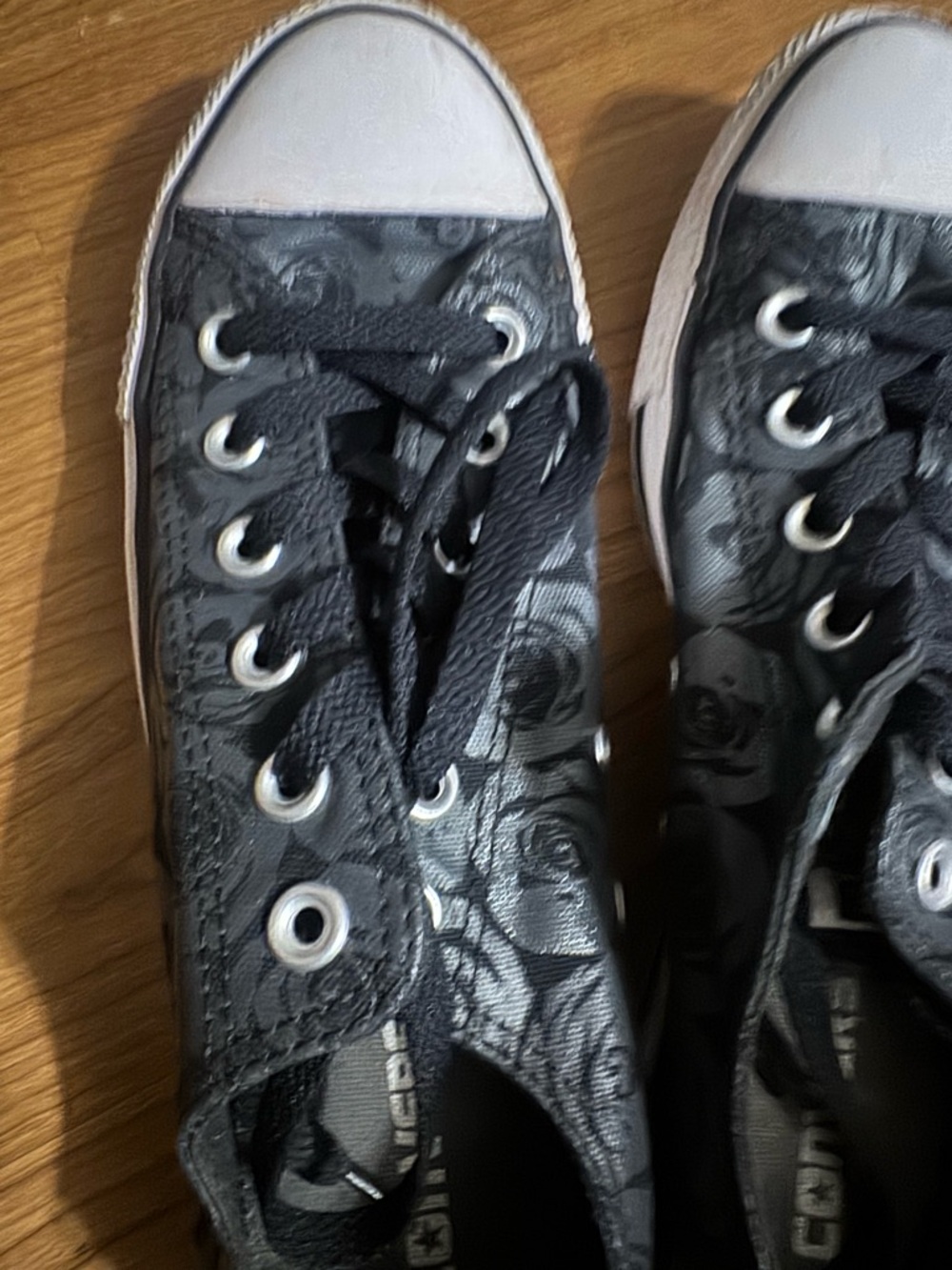 Converse women’s Black subtle rose print Floral sneakers